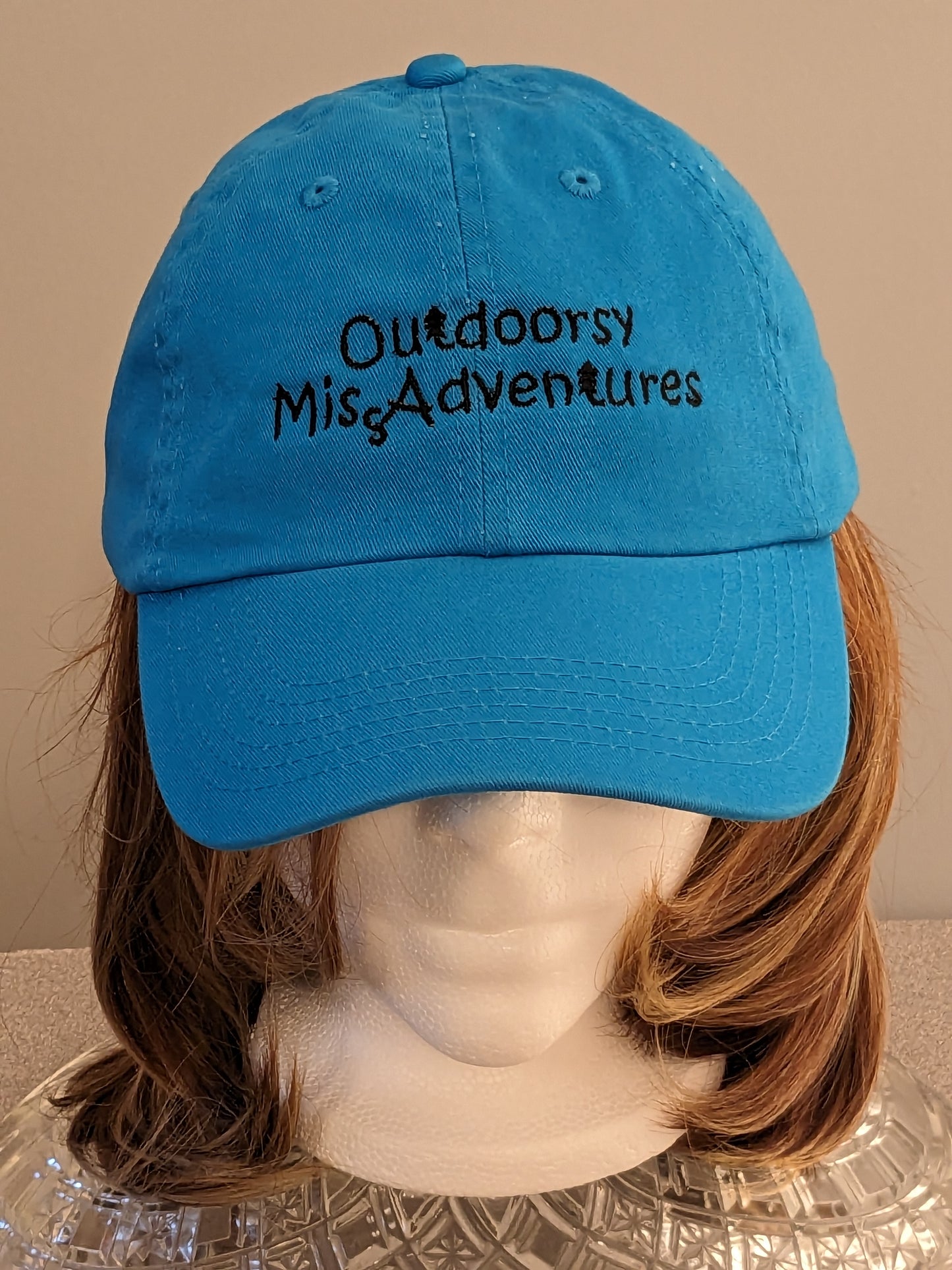 Outdoorsy Miss Adventures Embroidered Hat 100% Cotton colour = bright azure blue Embroidery = black this is a regular curved peak