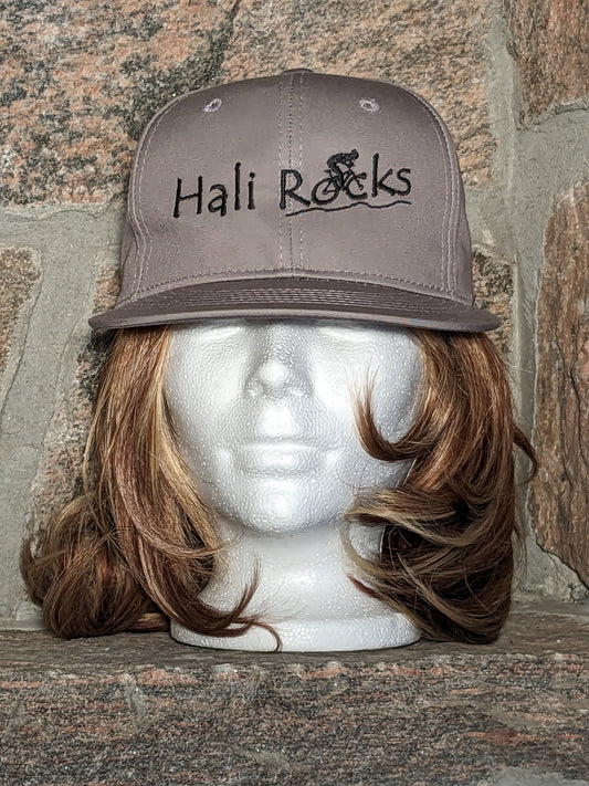 Hali Rocks Mtb Hat 100% Cotton flat peak colour = medium grey Embroidery = Black with cyclist climbing rocky trail