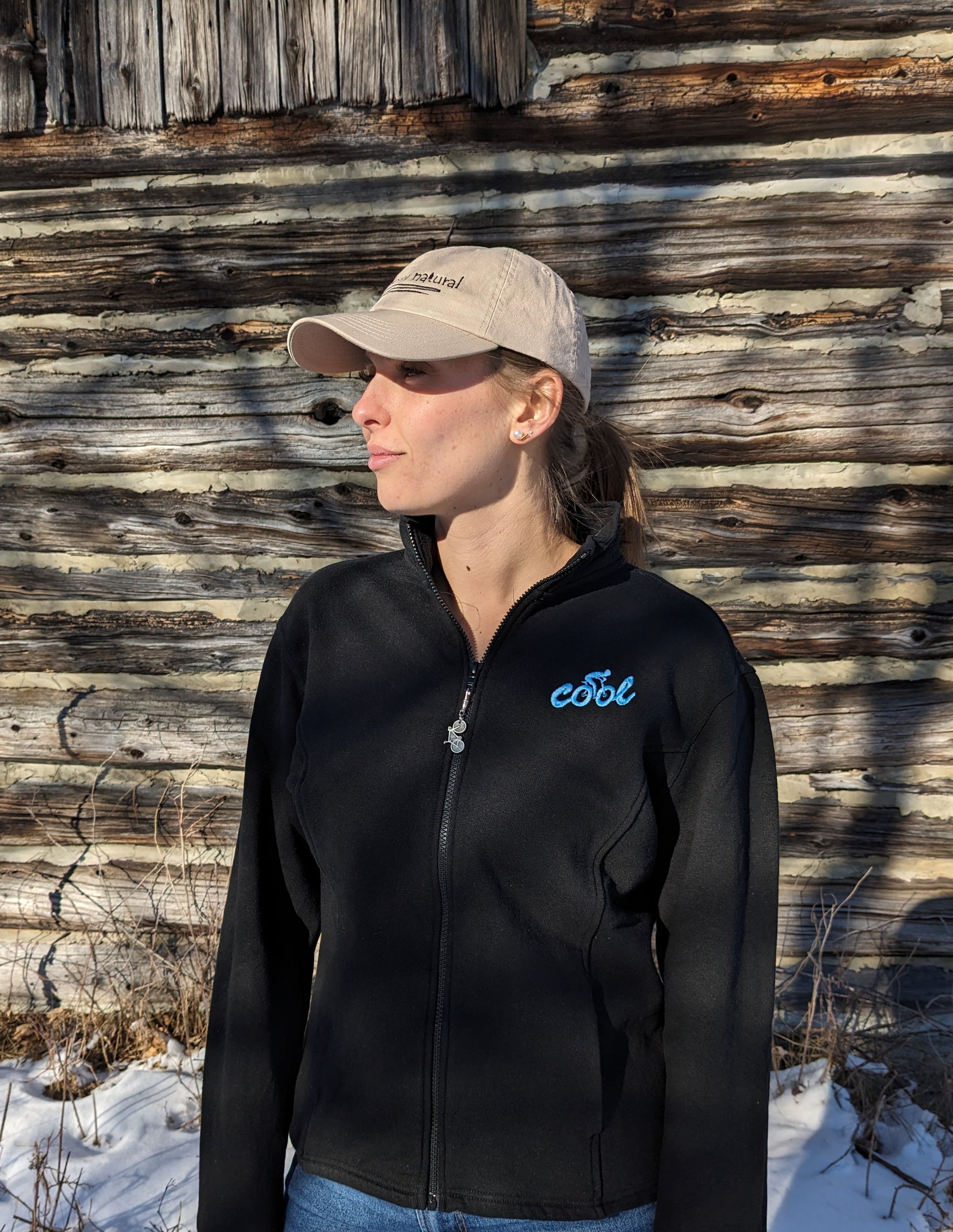 'Cool' embroidered upper left chest Hemp Track Jacket with removable pewter bike zipper pull - Women's sizing our model Morgan is wearing a black hemp track jacket with ice blue 'cool' +cyclist embroidered on upper left chest 55% Hemp 45% Organic Cotton – Fleece