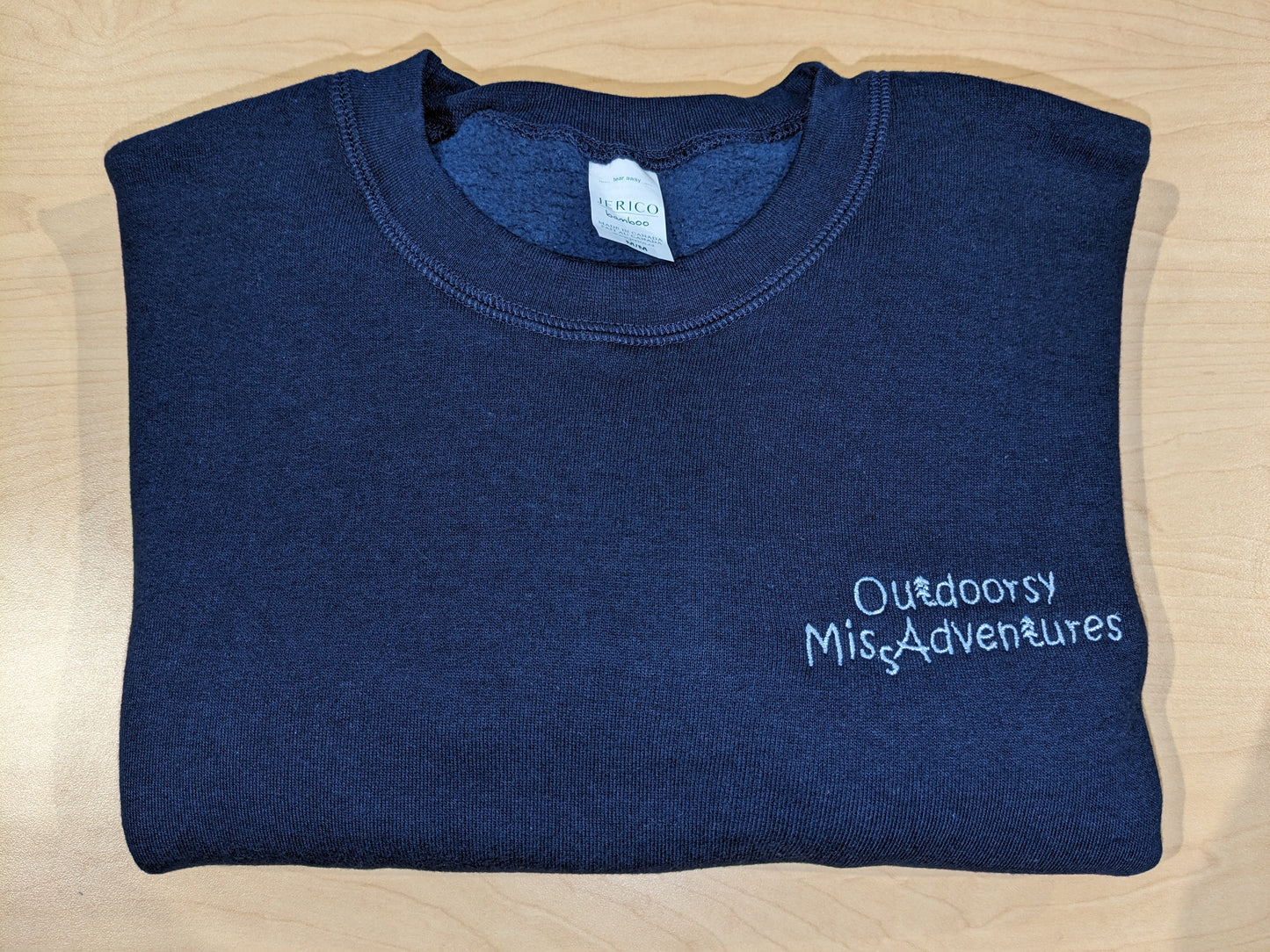 Outdoorsy Miss Adventures Three End Bamboo Fleece Crew Neck Sweatshirt colour= navy Embroidery= very light blue