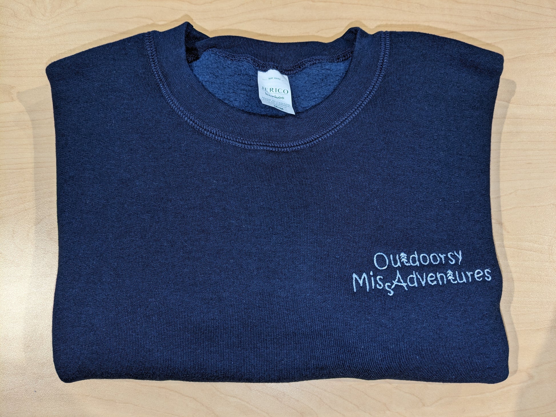 Outdoorsy Miss Adventures Three End Bamboo Fleece Crew Neck Sweatshirt colour= navy Embroidery= very light blue