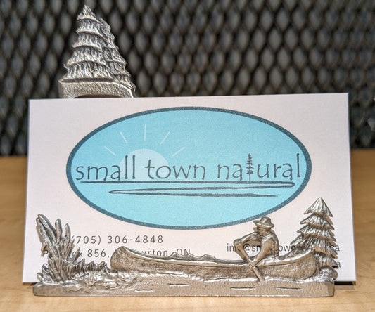 Small Town Natural now carries this outdoorsy business card holder that depicts a scene of a canoer paddling in the wilderness with a couple spruce trees in the background + foreground. Great for any outdoor adventuring  biz or the outdoor enthusiast's work or office desk. All pewter. Handmade in Ontario Canada since 1972
